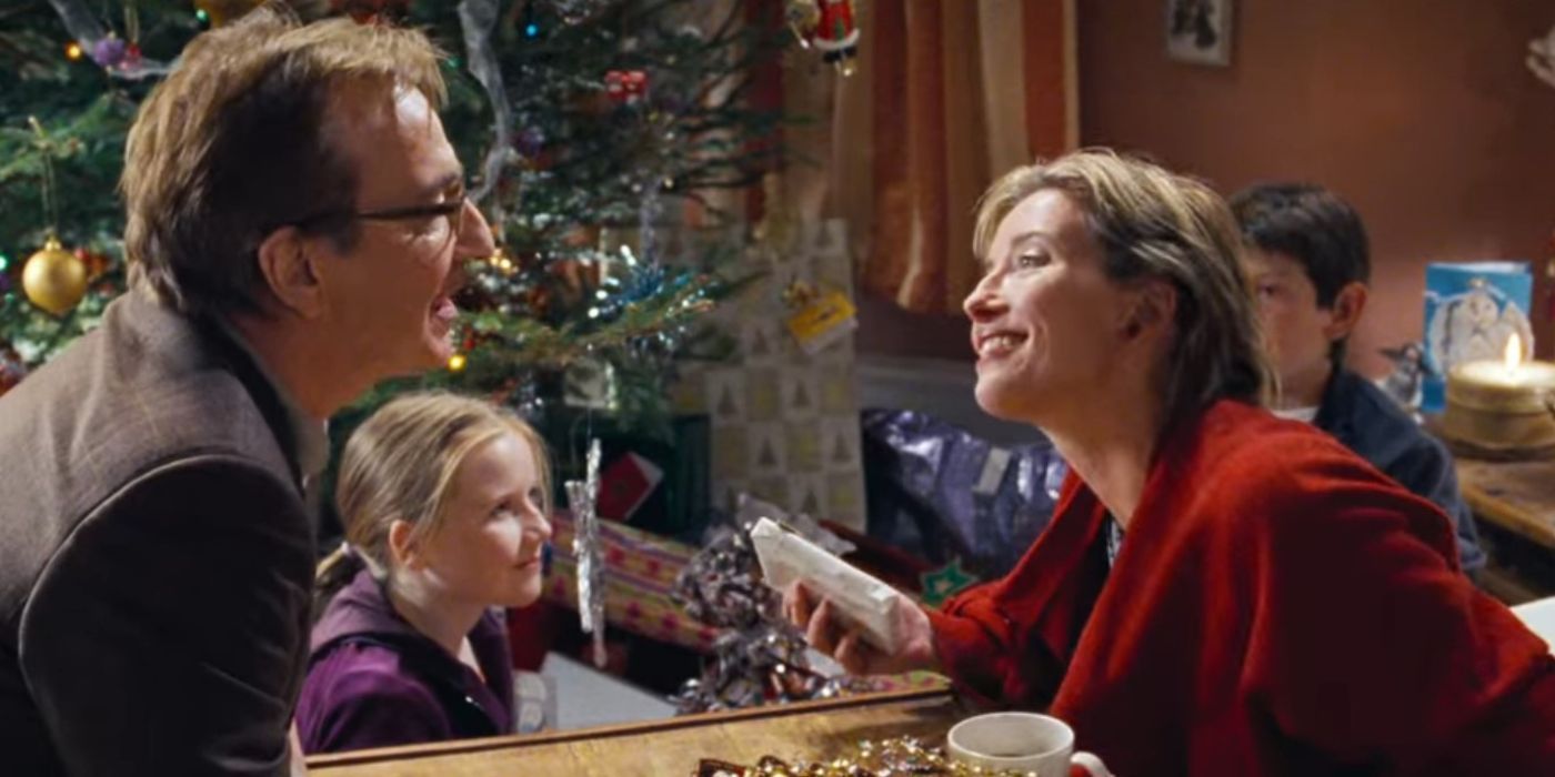 Karen (Emma Thompson) Smiling at Harry (Alan Rickman) Next to the Christmas Tree and Their Kids in Love Actually