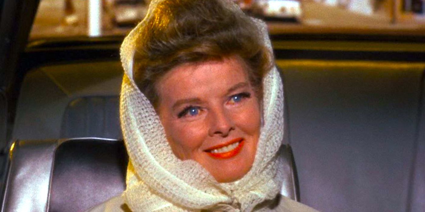 Katharine Hepburn as Christina Drayton sits smiling in a car in Guess Who's Coming To Dinner