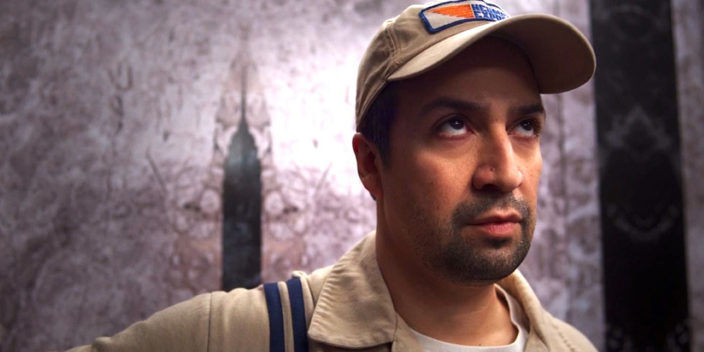 Lin-Manuel Miranda as Hermes in the elevator looking up in Percy Jackson and the Olympians episode 3