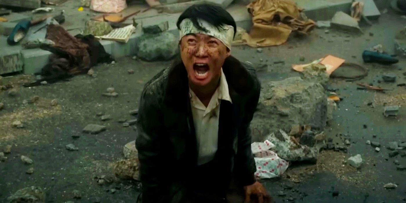Man with bandaged head surrounded by rubble screaming in Godzilla Minus One