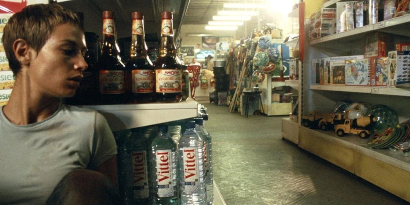 Marie from High Tension hiding behind a shelf in a store