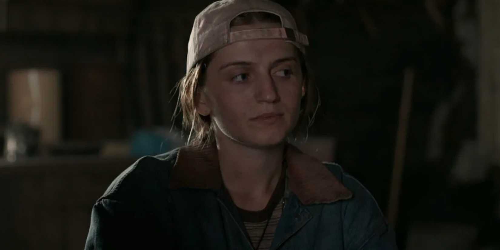 Melissa in a backwards baseball cap appears thoughtful in Yellowjackets