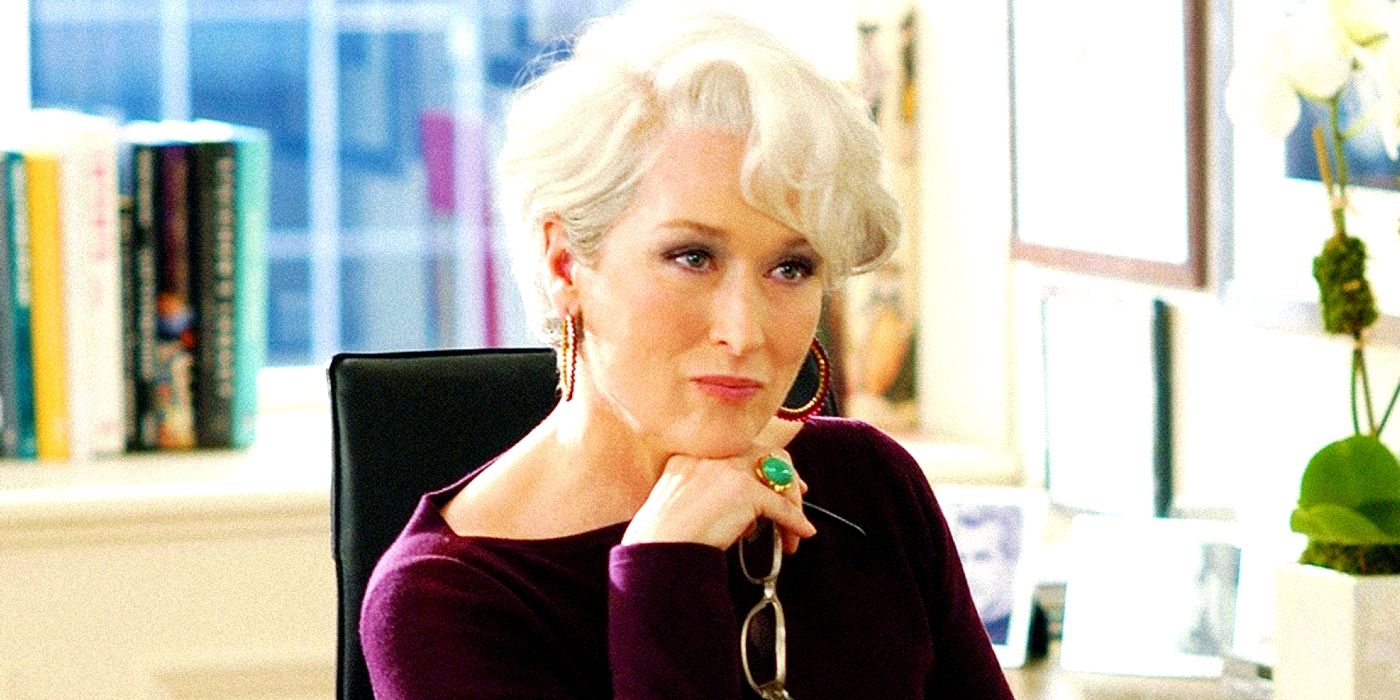 Meryl Streep resting her chin on her hand as Miranda Priestly in The Devil Wears Prada