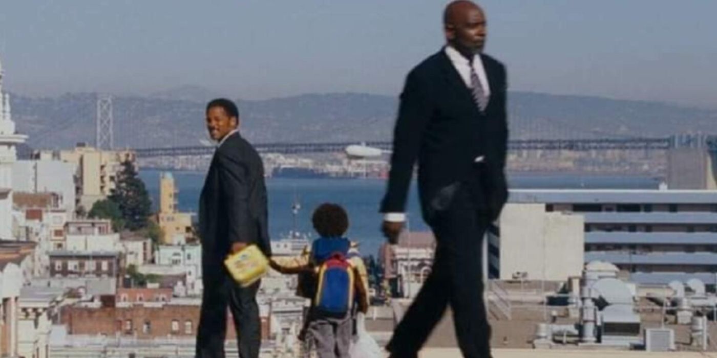 Chris (Will Smith) and Carl Jr. (Jaden Smith) walking past the real Chris Gardner in The Pursuit of Happyness