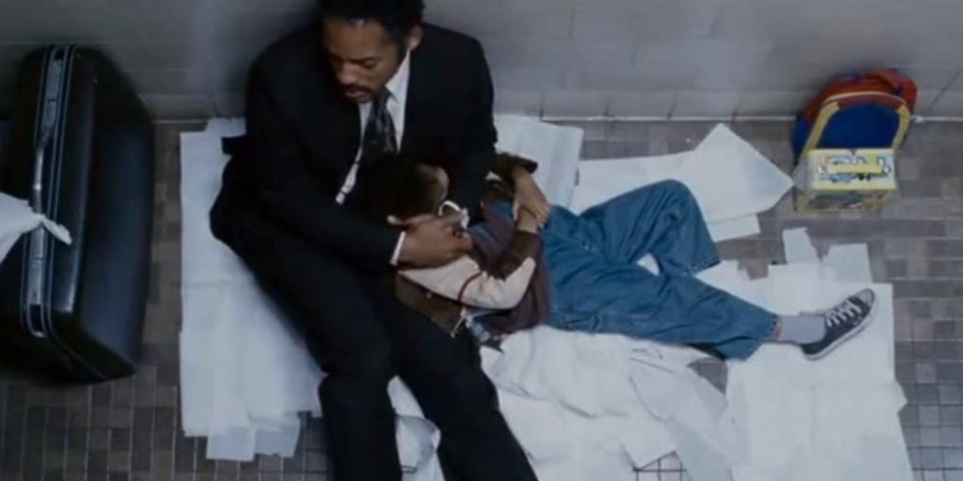 Chris (Will Smith) and Carl Jr. (Jaden Smith) sleeping in a public restroom in The Pursuit of Happyness