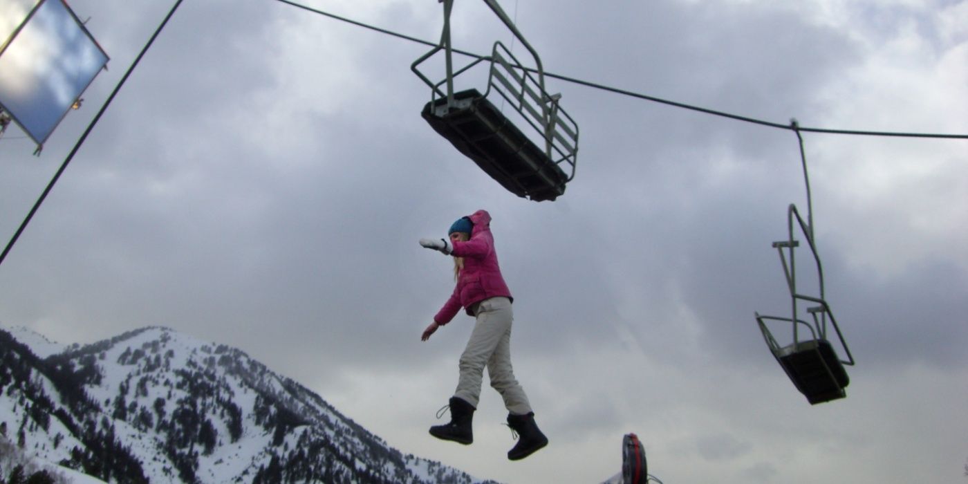 Parker (Emma Bell) jumps from the ski lift in Frozen