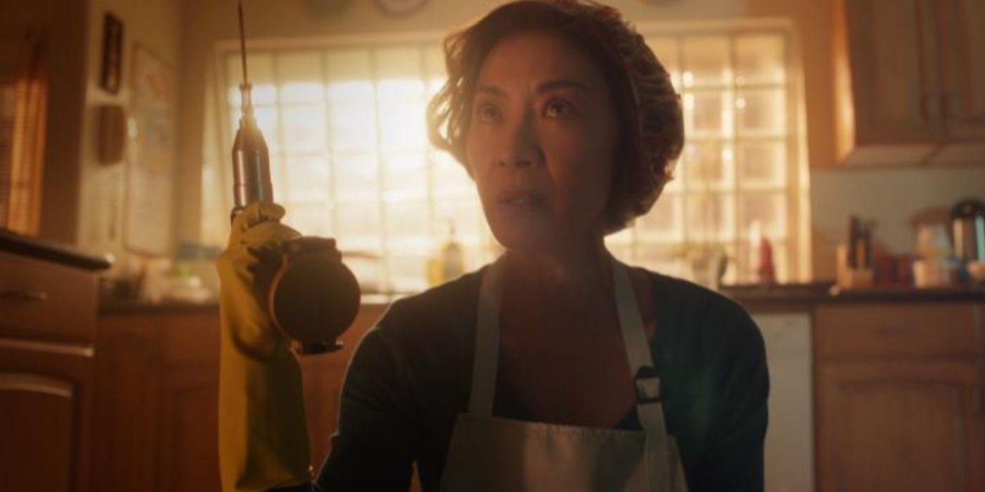 Mama (Michelle Yeoh) holds a drill in The Brothers Sun.