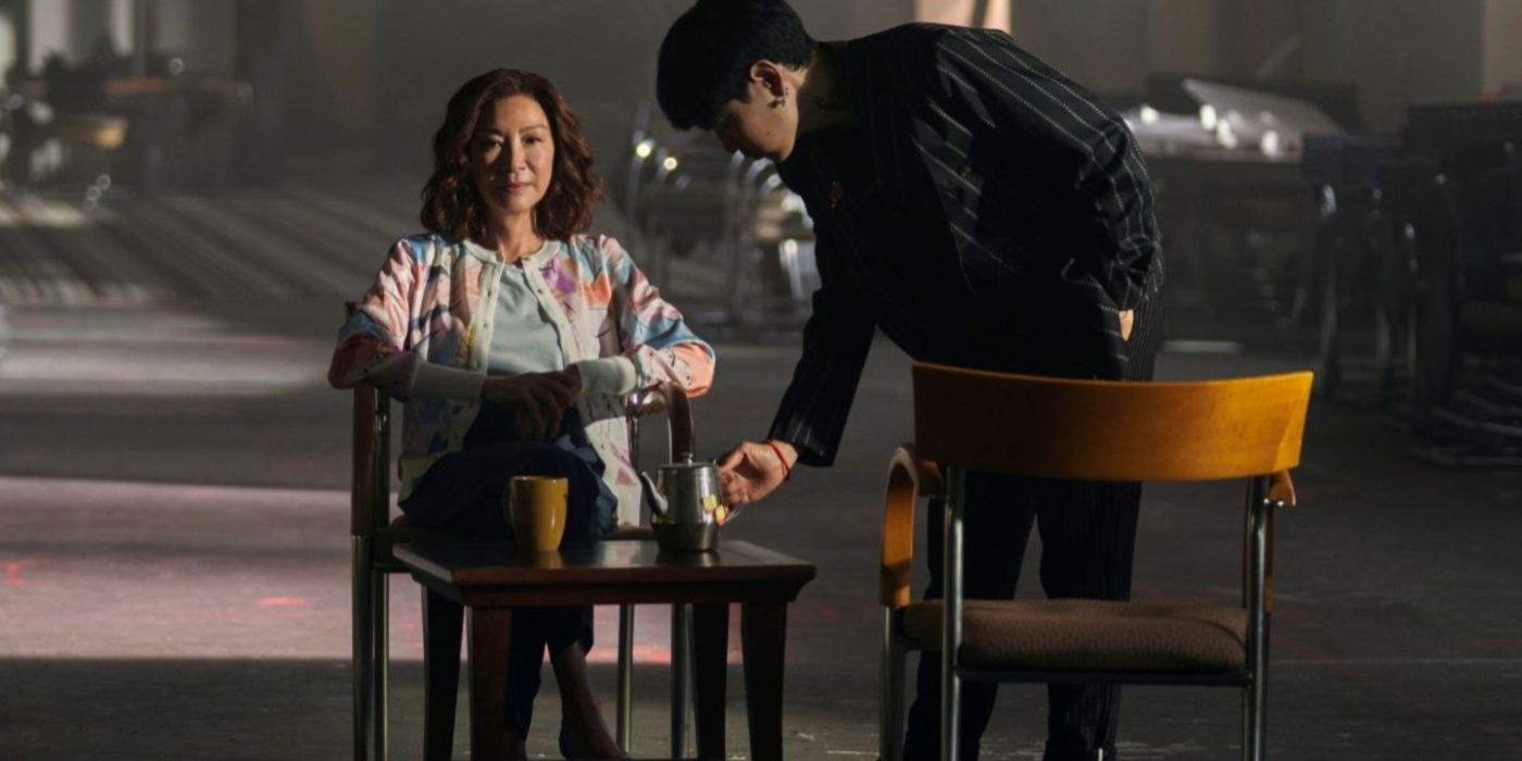 Bruce (Sam Li) and Mama (Michelle Yeoh) drink tea in The Brothers Sun