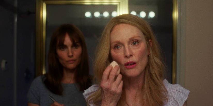 Natalie Portman As Elizabeth Berry And Julianne Moore As Gracie Atherton talking in a bathroom In May December.