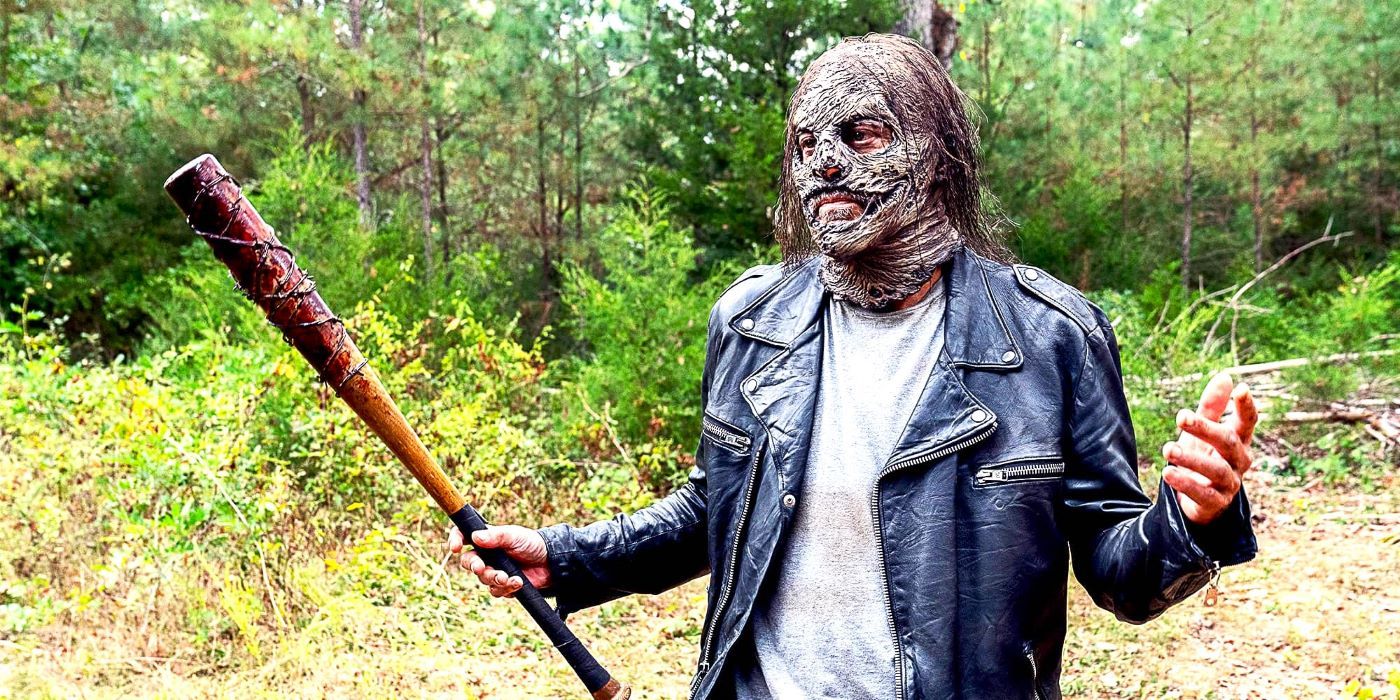 Negan in a Whisperer mask and holding a bat in The Walking Dead season 10