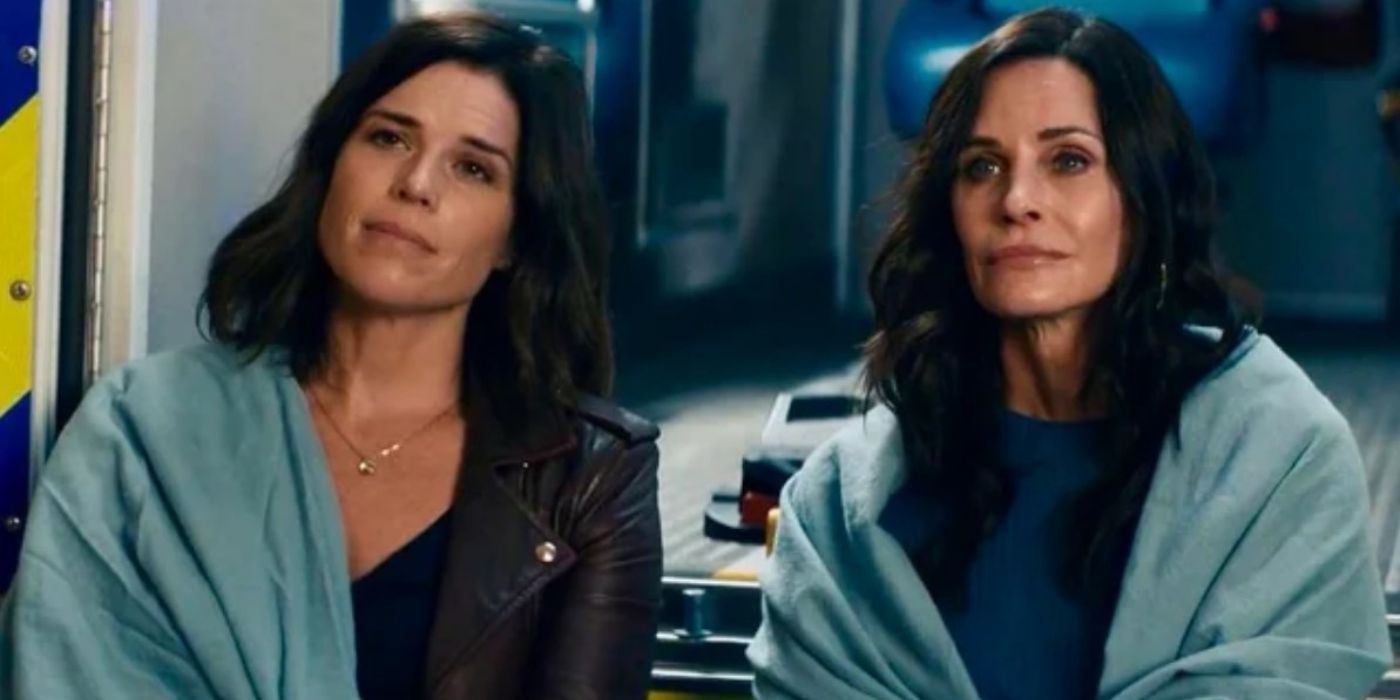 Neve Campbell as Sidney Prescott and Courteney Cox as Gale Weathers with blankets over their shoulders in Scream 5