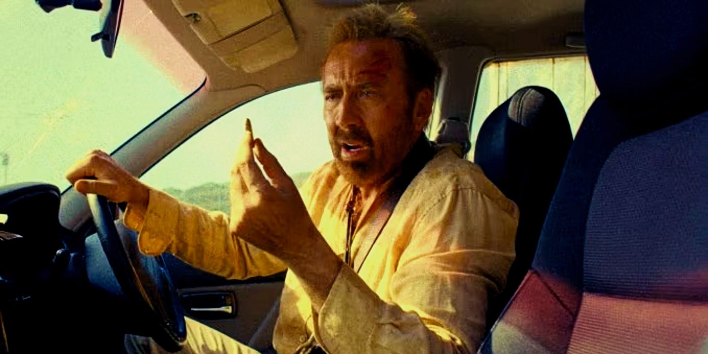 Nicolas Cage holding a bullet in a car in The Surfer