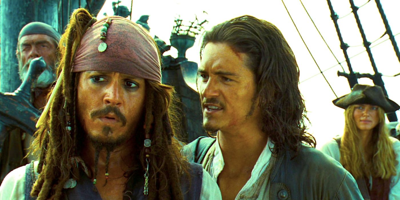 Orlando Bloom's Will speaks to Johnny Depp's Jack Sparrow as Kiera Knightley's Elizabeth looks on on a ship in Pirates of the Caribbean Dead Man's Chest