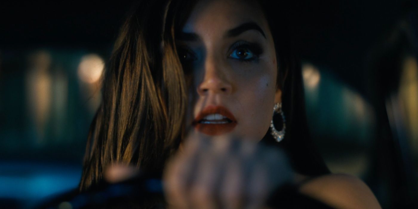 Dramatic closeup of Paloma (Ana de Armas) driving a car in No Time to Die