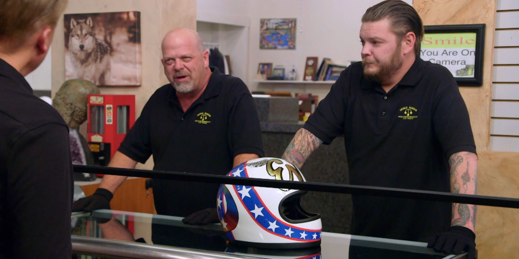 Pawn stars cast talking with customer about an item