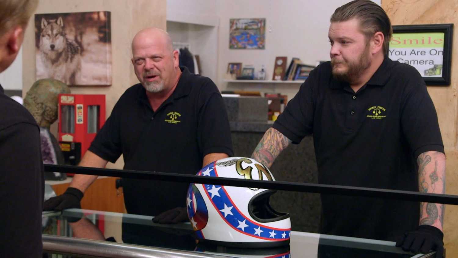 Pawn stars cast talking with customer about an item