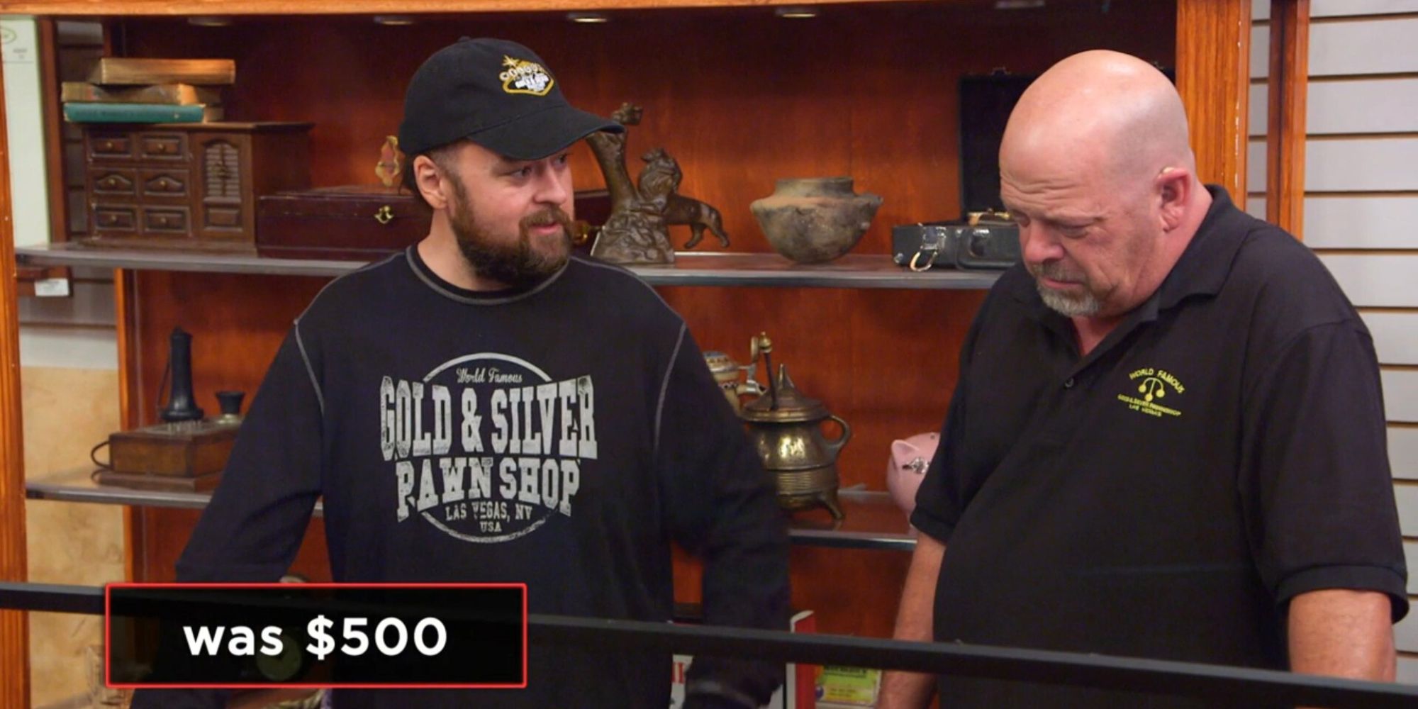 Pawn Stars' Rick and Chumlee talking over an item