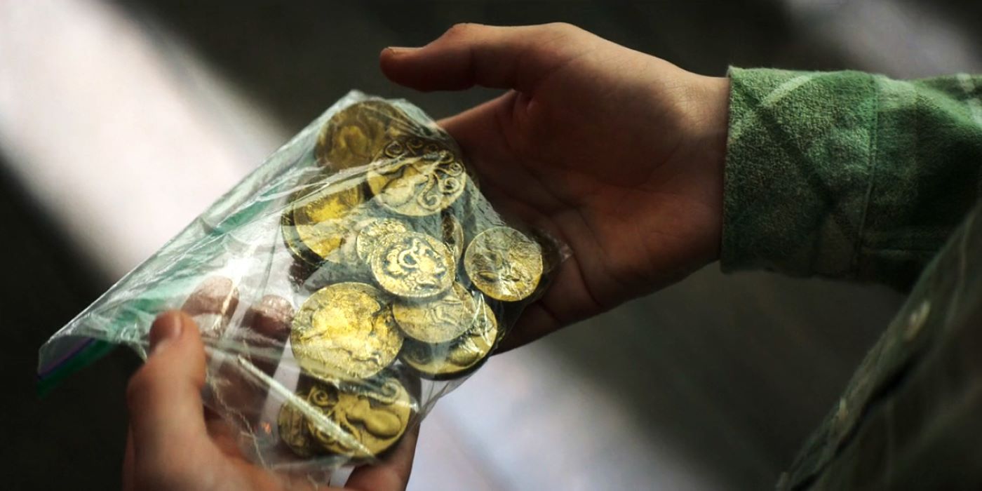Percy holding a bag of drachmas in Percy Jackson and the Olympians episode 3