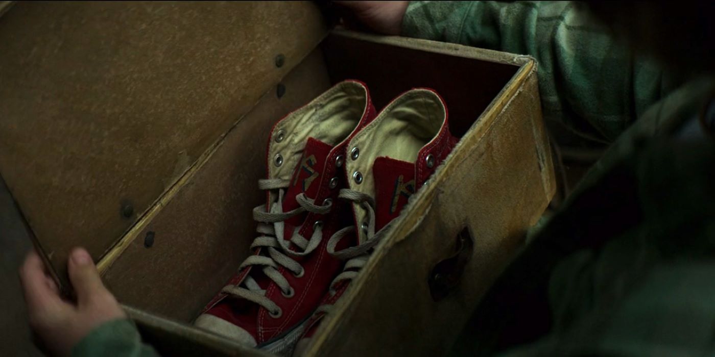 Percy looking at the winged sneakers Luke gives him in Percy Jackson and the Olympians episode 3