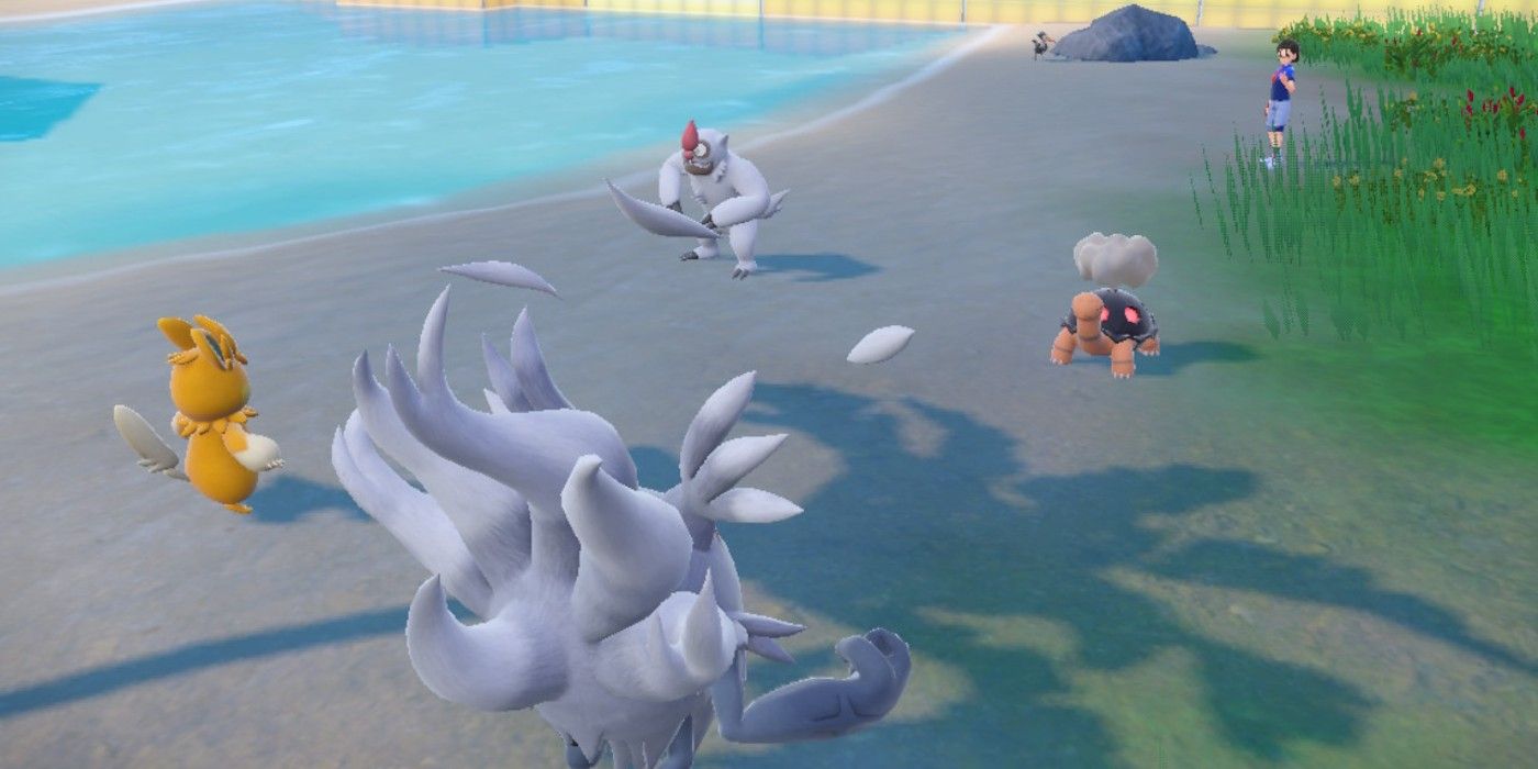 A player’s Pawmot and Annihilape face an NPC’s Vigoroth and Torkoal in a Double Battle in Pokémon Scarlet and Violet’s Indigo Disk DLC.