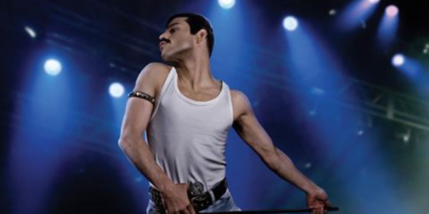 Rami Malek as Freddie Mercury dancing on stage in Bohemian Rhapsody 