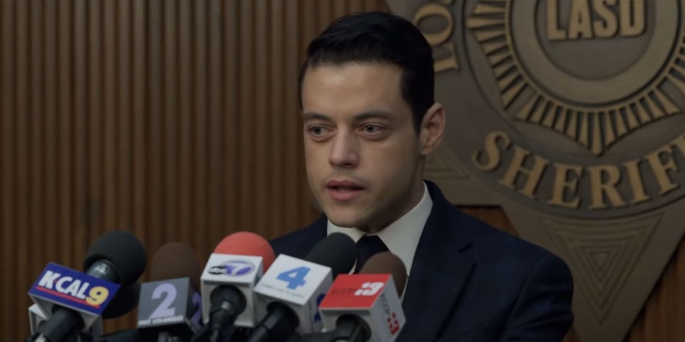 Rami Malek as Baxter in The Little Things giving a press conference.