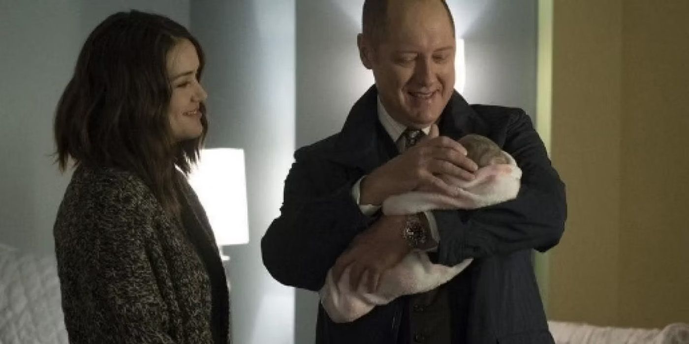 Raymond Reddington holding a baby on The Blacklist.