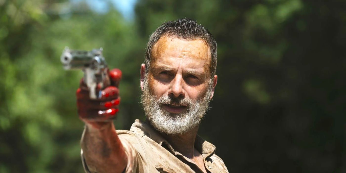 Rick Grimes with a bloody hand aiming his gun in The Walking Dead season 9 episode 5