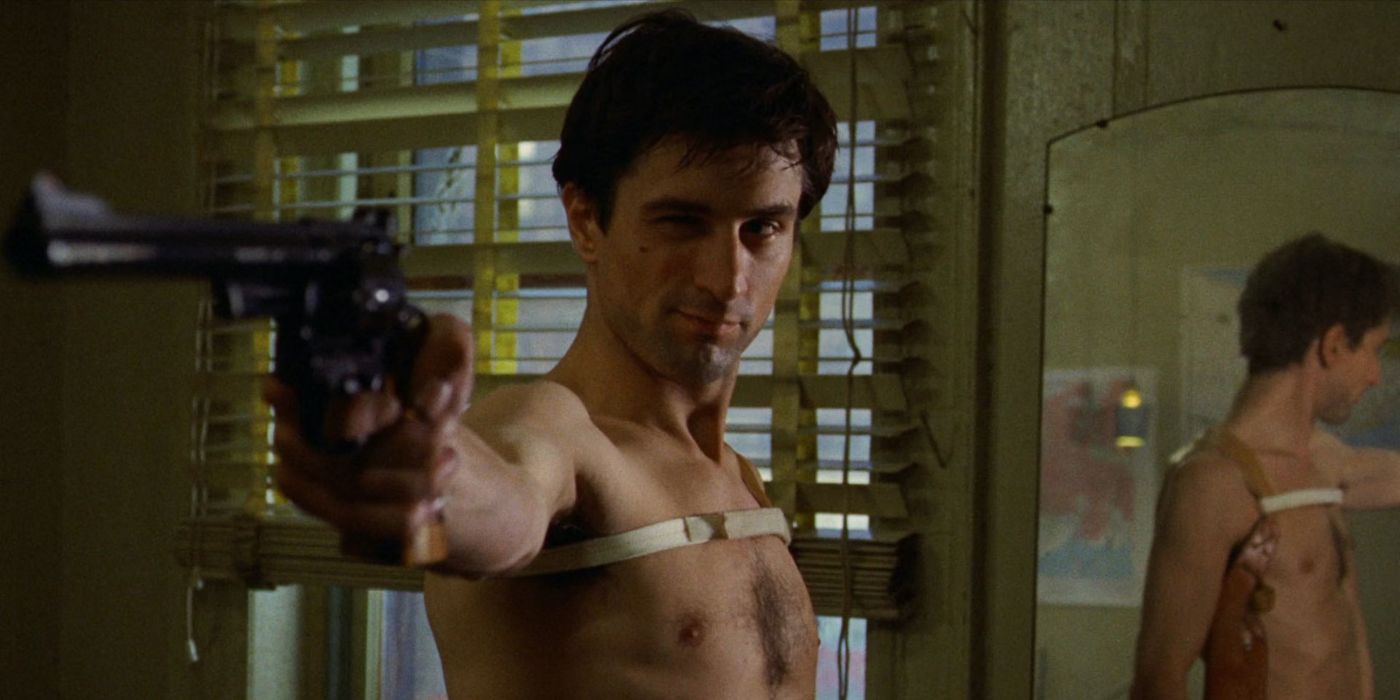 Robert De Niro as Travis Bickle aims his revolver at the wall in a scene from Taxi Driver.