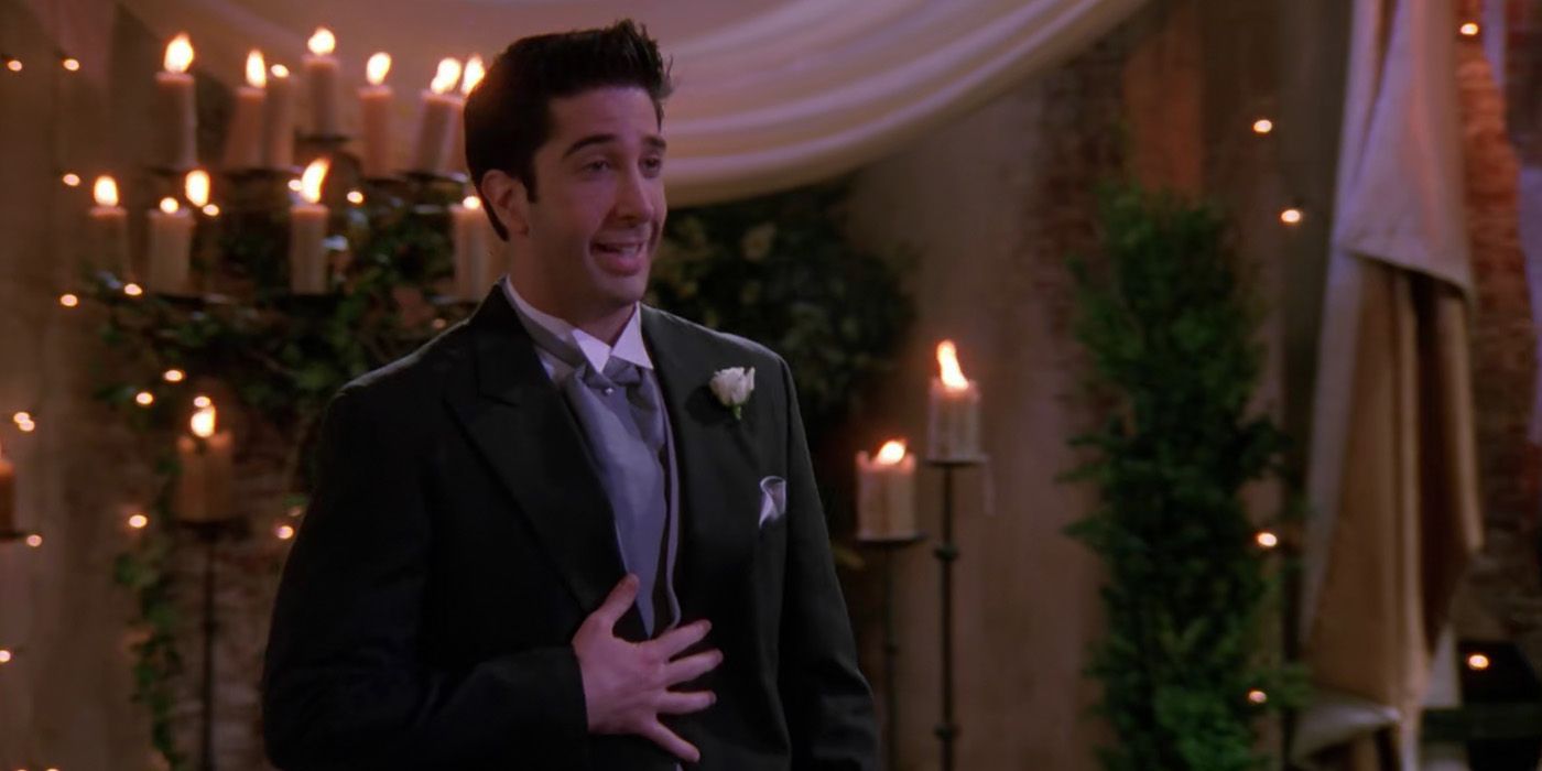 David Schwimmer as Ross Gellar looking surprised in a wedding suit in Friends