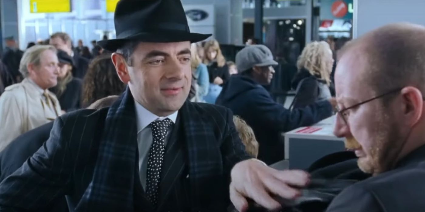 Rowan Atkinson's Rufus handing out his gloves and jacket in the airport scene in Love Actually