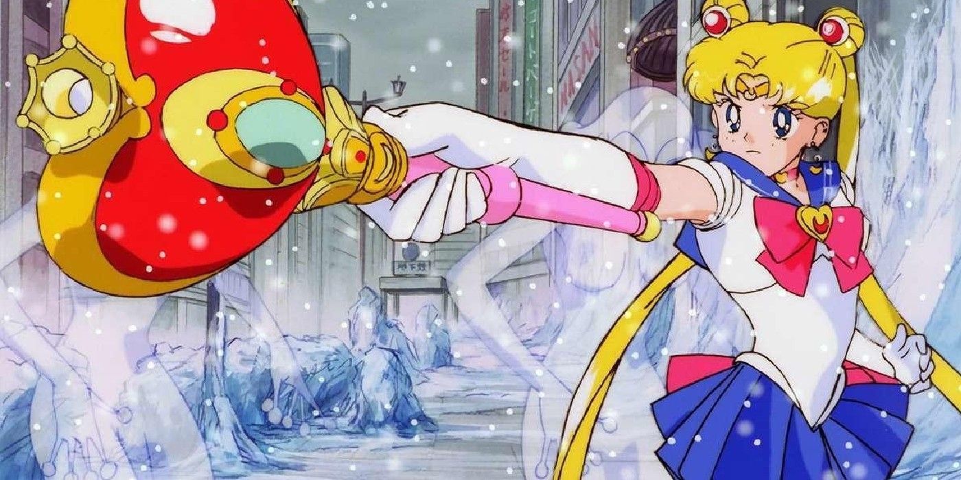 Usagi em Sailor Moon S apontando sua arma icônica para frente