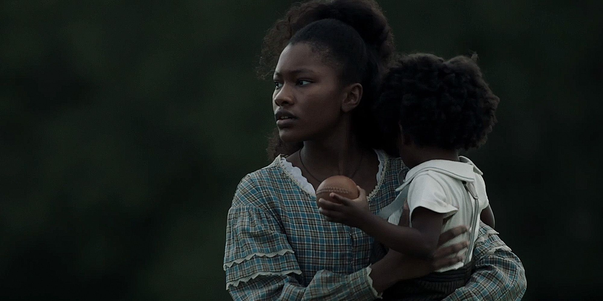 Sally Reeves holding a child in Lawmen Bass Reeves episode 6