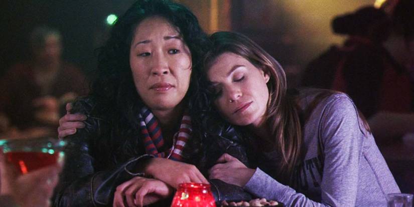 Sandra Oh as Cristina Yang and Ellen Pompeo as Meredith Grey hugging in Grey's Anatomy season 2 premiere