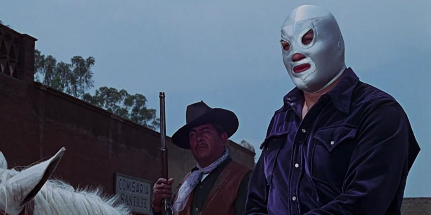 Santo (Rodolfo Guzmán Huerta) riding a horse with a man with a gun behind him in Santo vs the Riders of Terror.