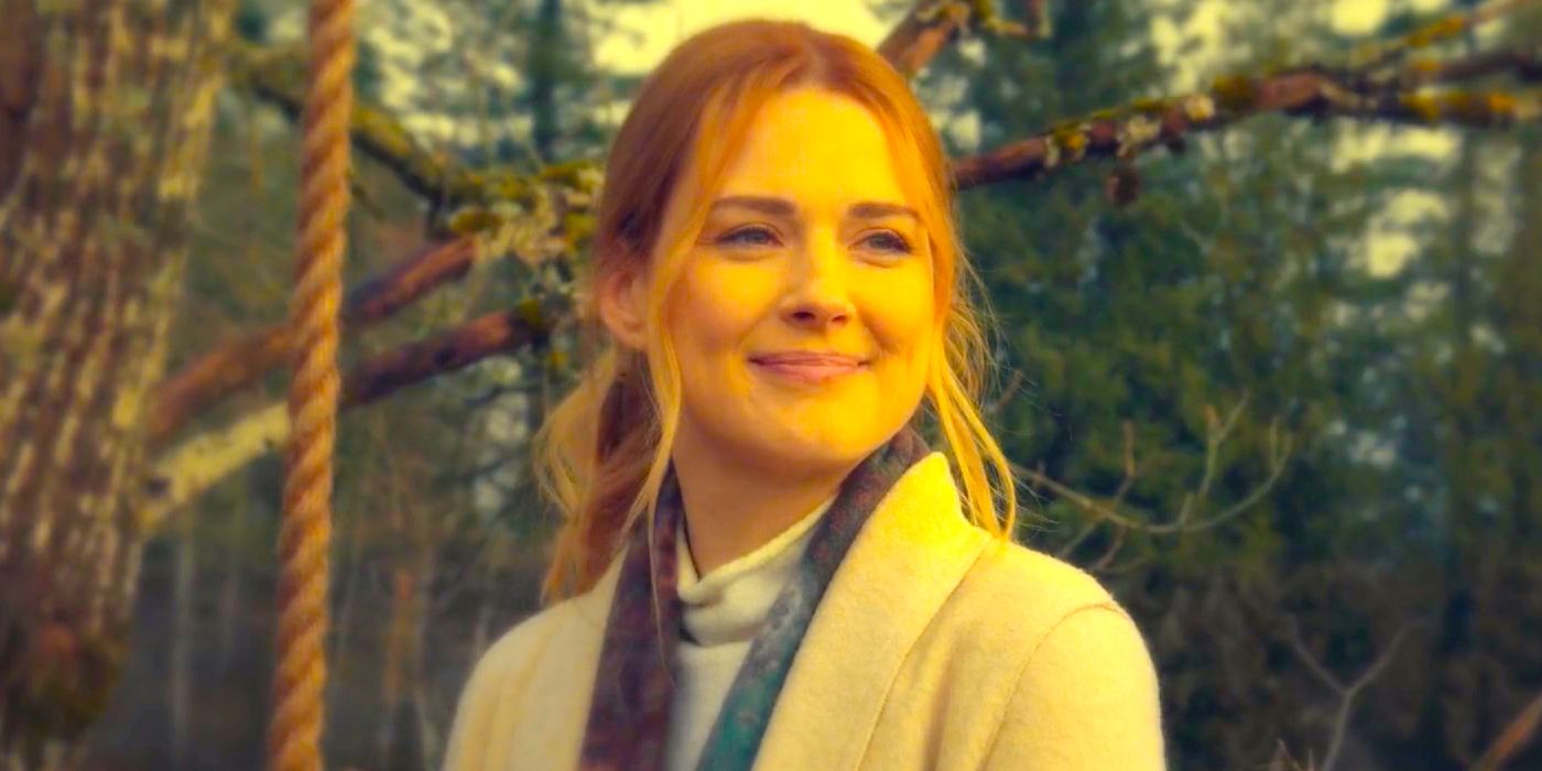 Mel holding a swing while smiling in front of a forrest in Virgin River season 5 episode 10