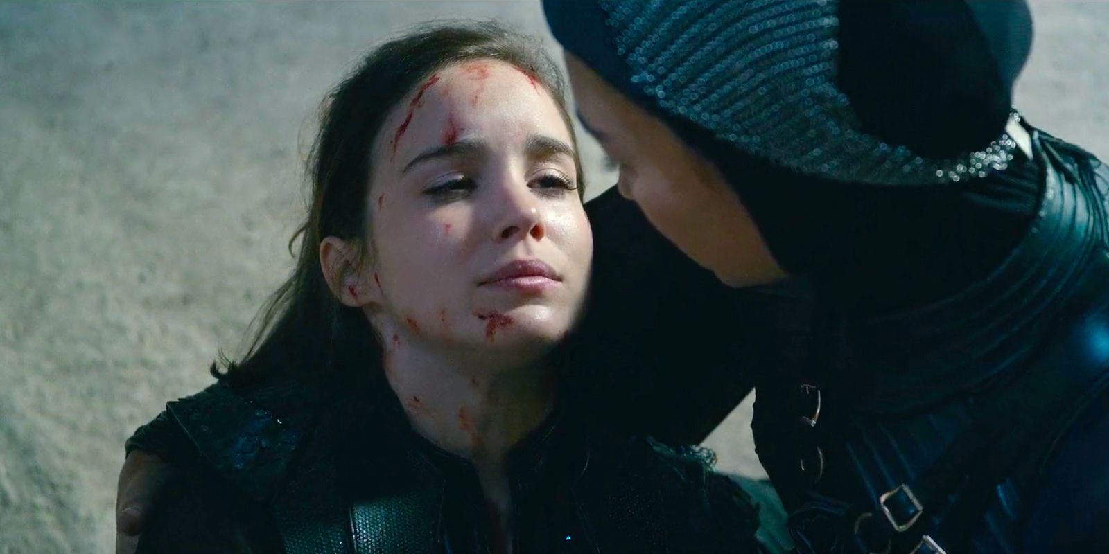 Ava laying bloodied in Beatrice's arms after defeating Adriel in Warrior Nun season 2 episode 8.