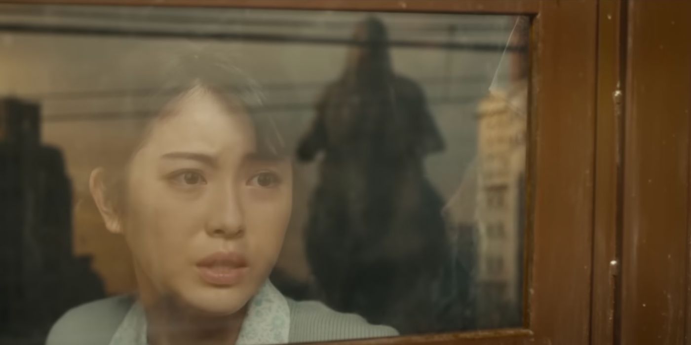 Minami Hamabe as Noriko Looking at Godzilla Outside a Train Window in Ginza in Godzilla: Minus One