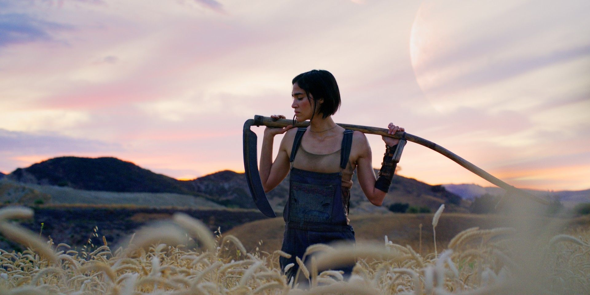 Sofia Boutella as Kora standing in a field in Rebel Moon - Part One: A Child of Fire