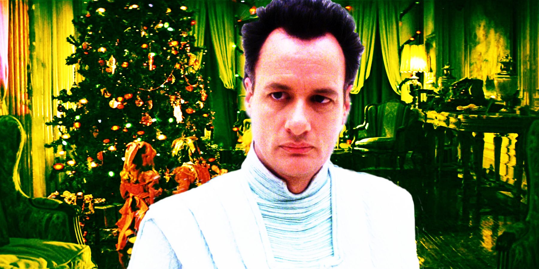 John de Lancie as Q in white robes against a green Christmassy backdrop