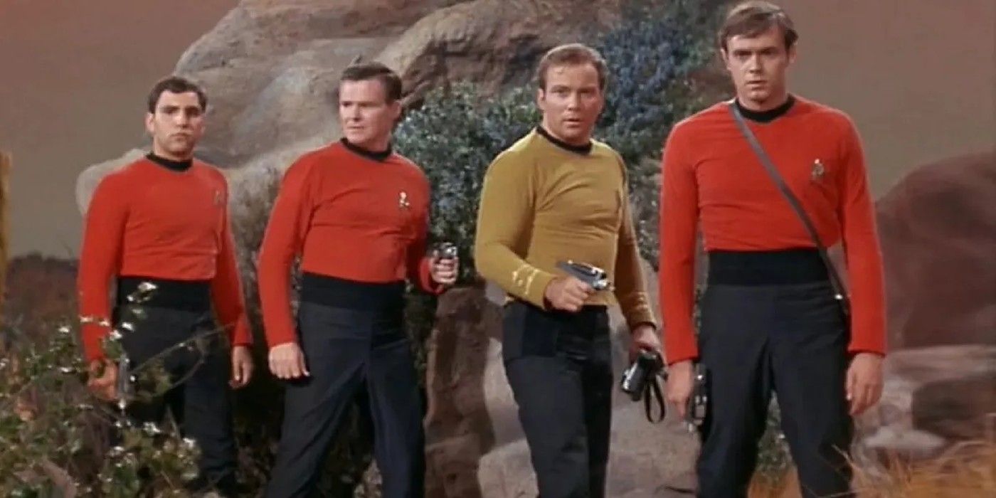 Image of Captain Kirk standing with three red shirts.
