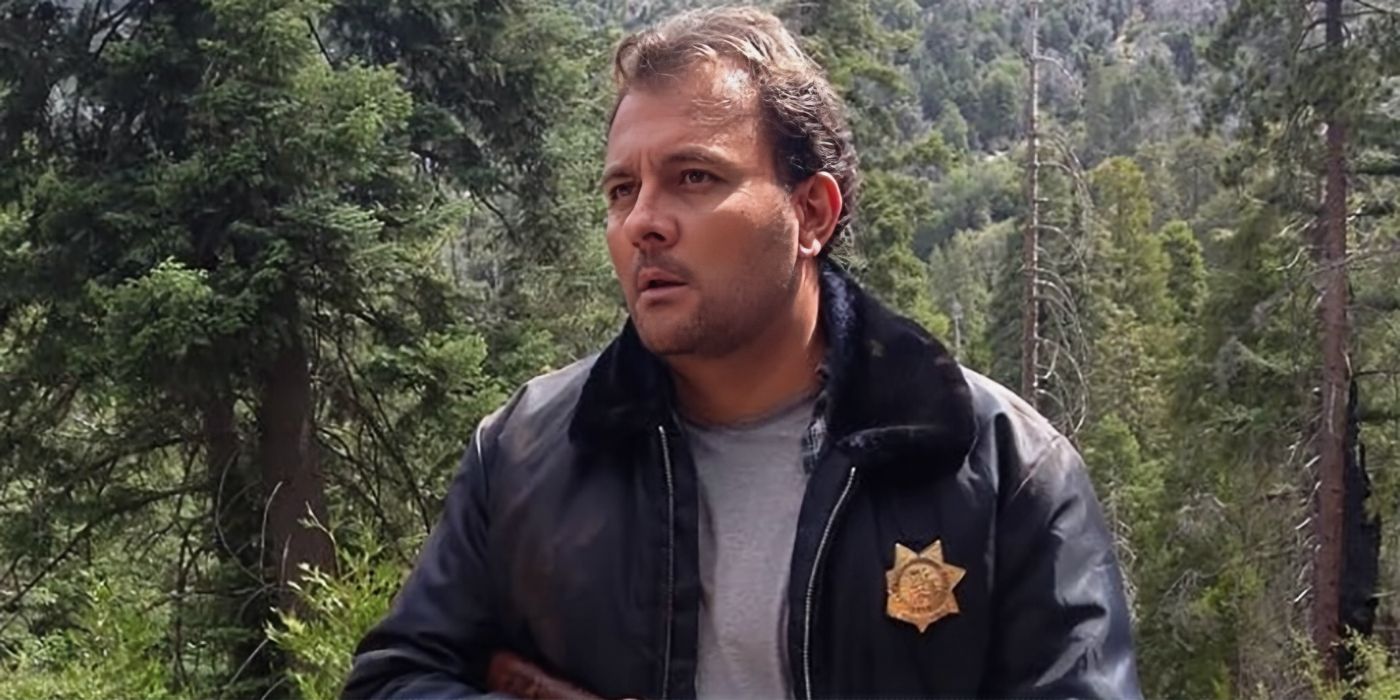 Stelio Savante as Sheriff Bill McCallister in the woods in Army Dog