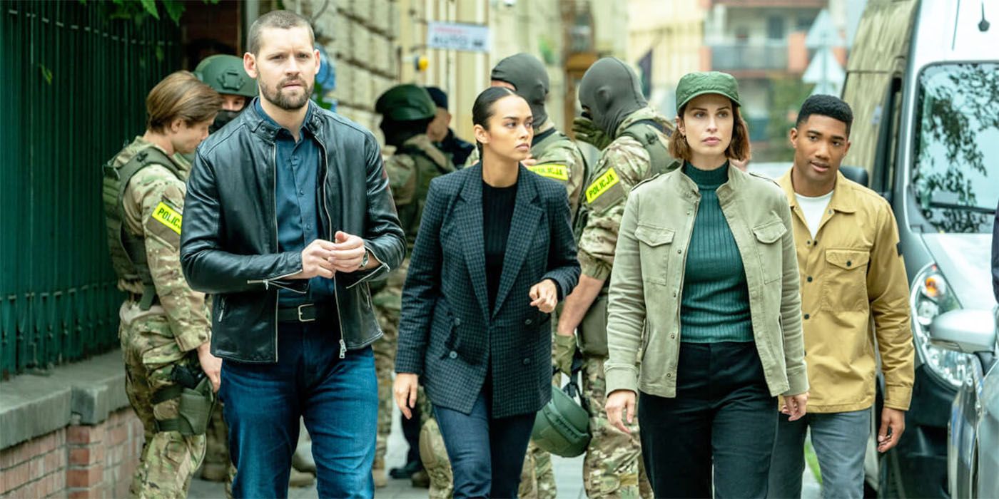 The cast of FBI International looking and walking around