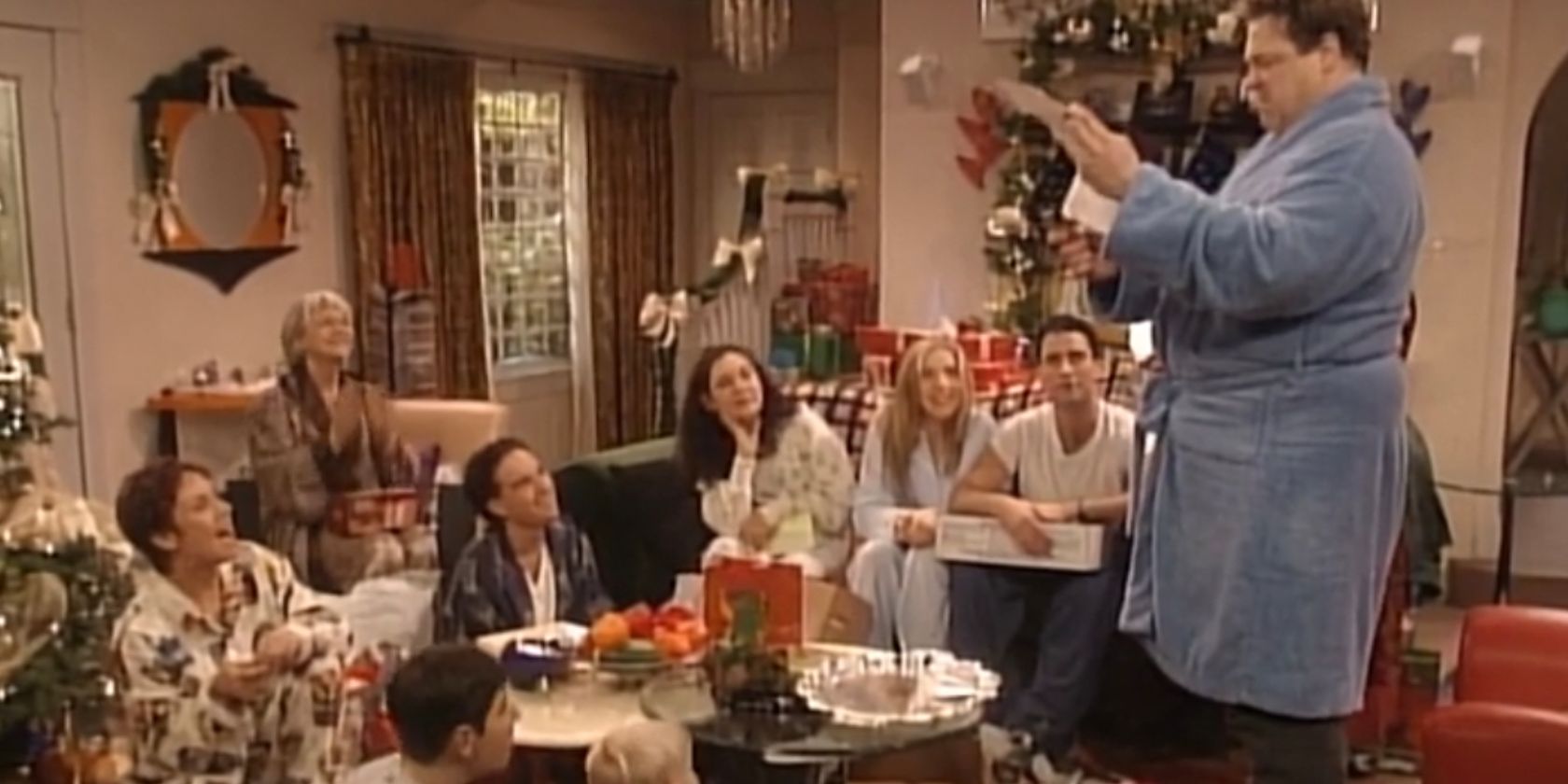 The Conner family opening their Christmas presents in the living room in the Roseanne episode Home for the Holidays