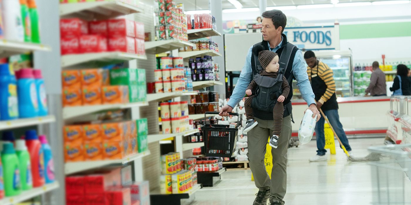 the family plan scene of mark wahlberg with baby in grocery store