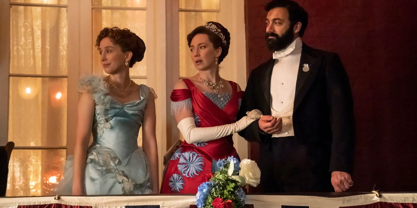 Gladys, Bertha, and George Russell dressed in finery and standing on a balcony together in The Gilded Age season 2