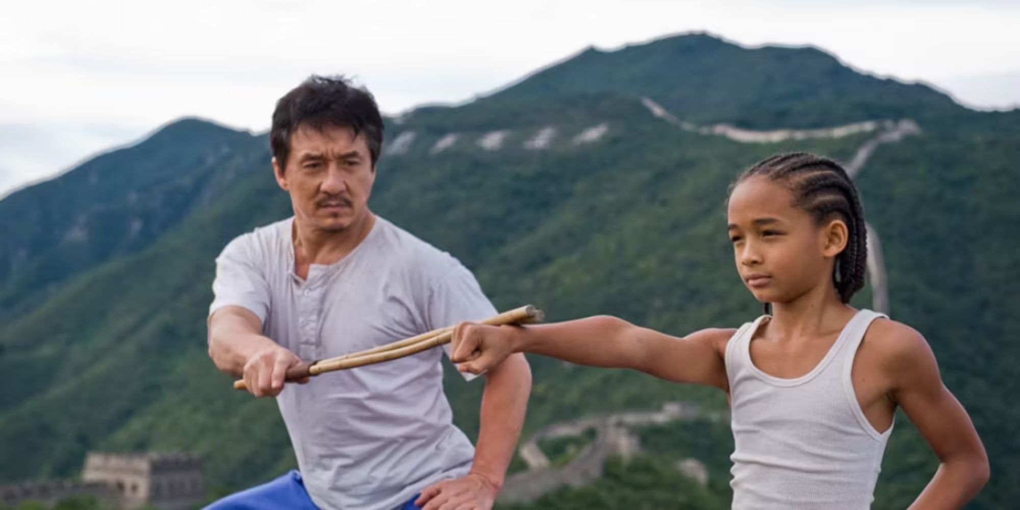 Jackie Chan as Mr. Han, training Jaden Smith as Dre in The Karate Kid