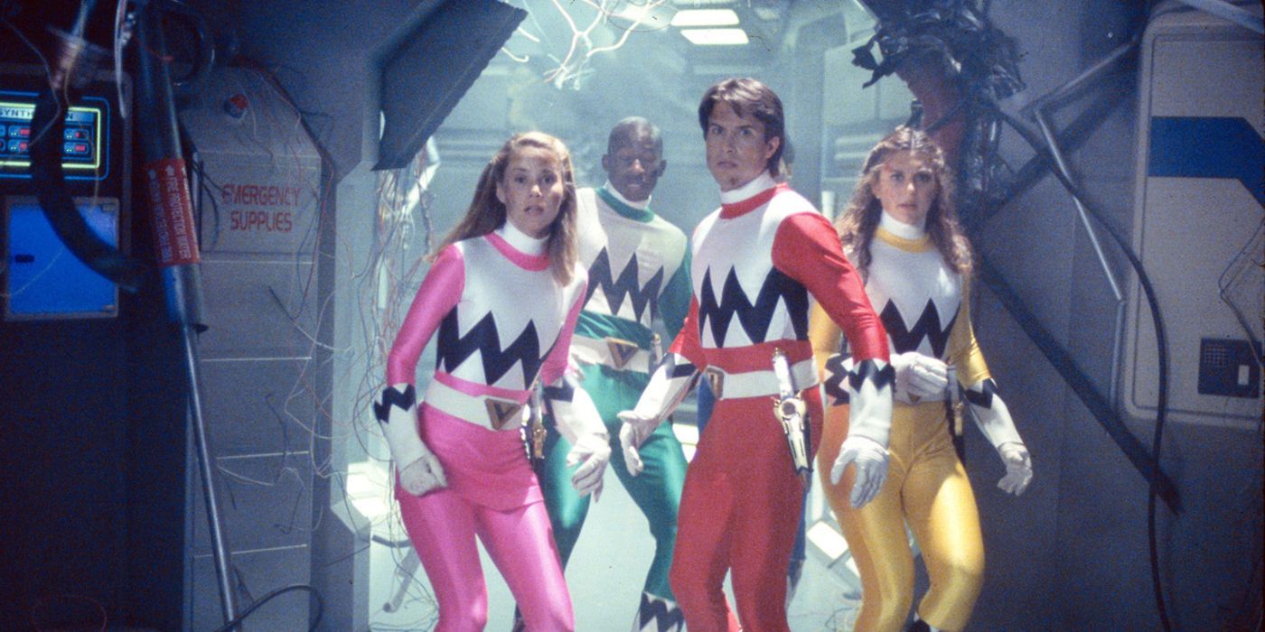 The Lost Galaxy Power Rangers waking through a destroyed Terra Venture