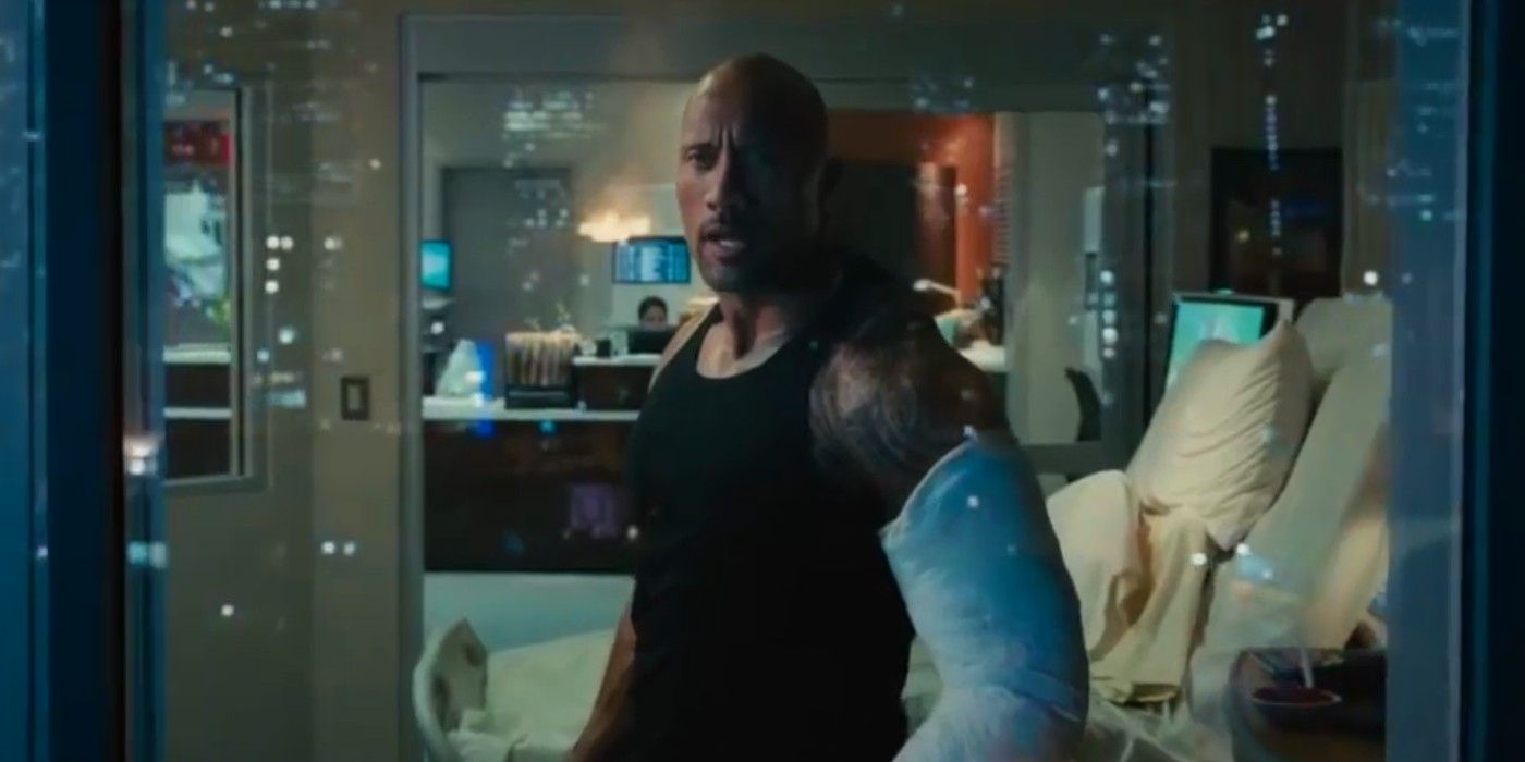 The Rock as Luke Hobbs wearing a cast in Furious 7