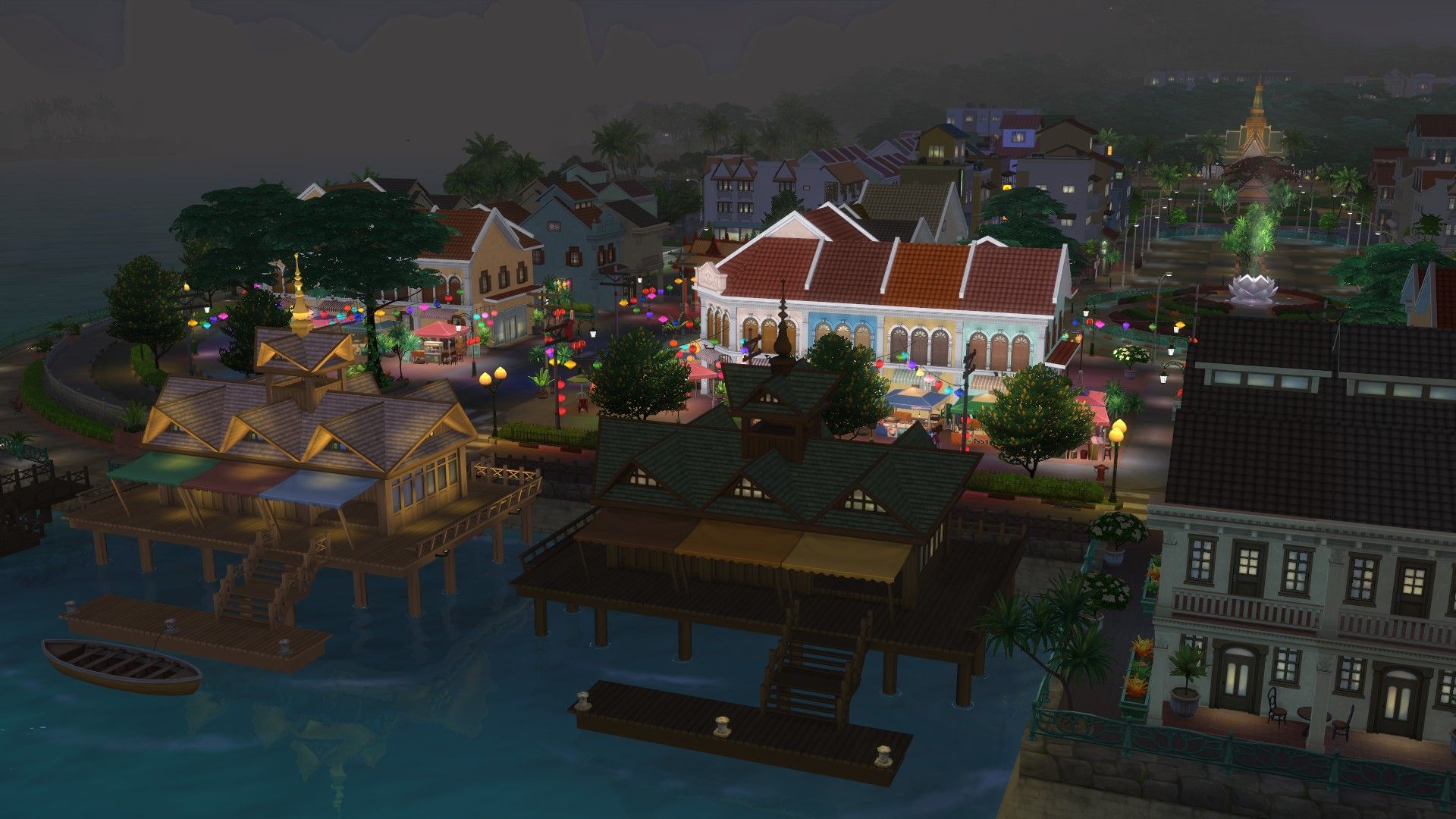 The Sims 4 For Rent Tomarang harbor showing a boat in the water and the night market area lit by lanterns and a temple in the distance.